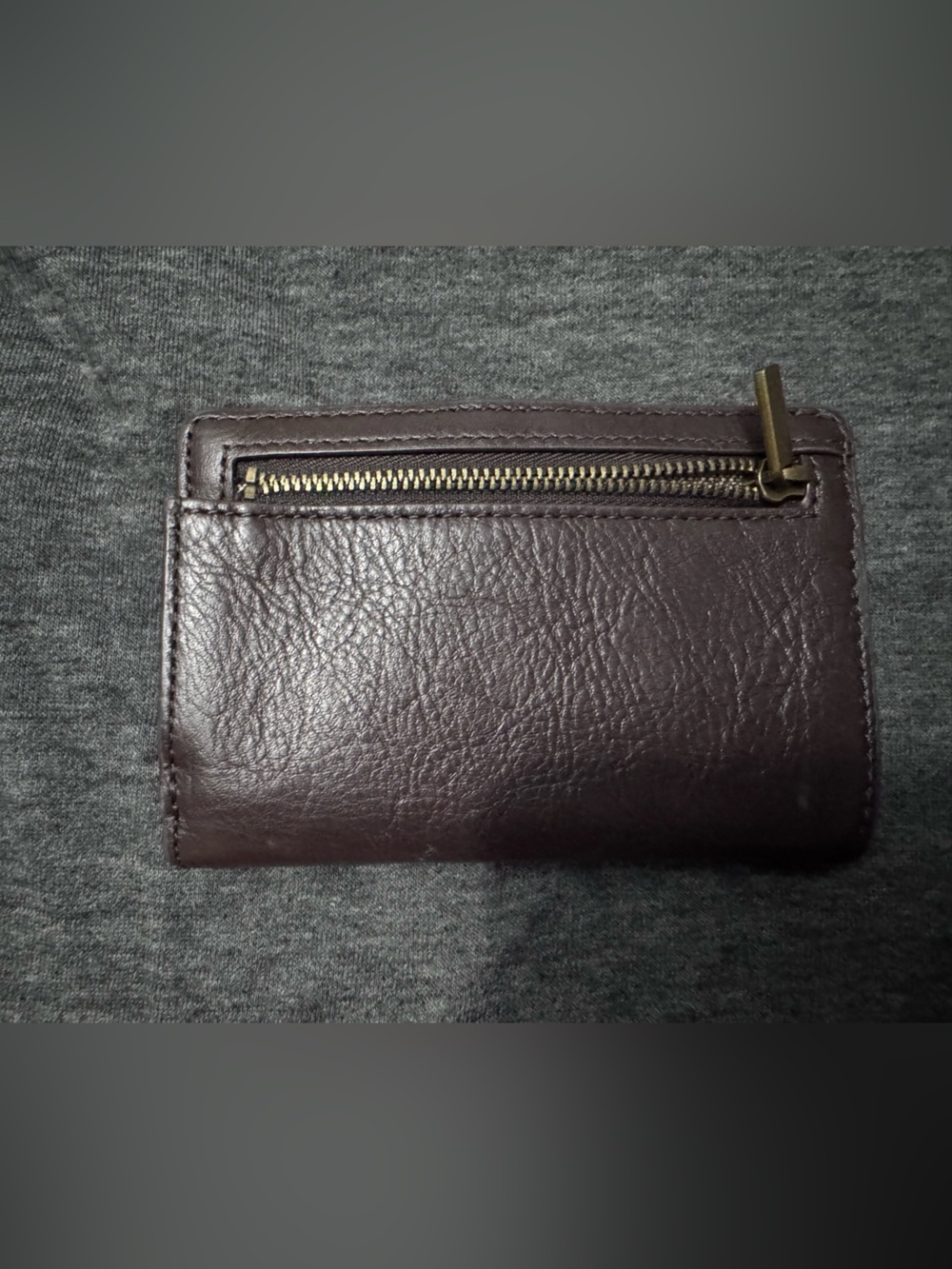 Fossil brown leather wallet with brass accent